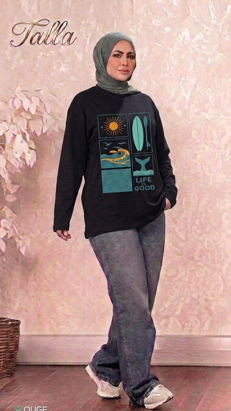 Talla | طلةّ black long sleeve sweatshirt with Life is Good graphic print worn by a woman in a hijab and jeans