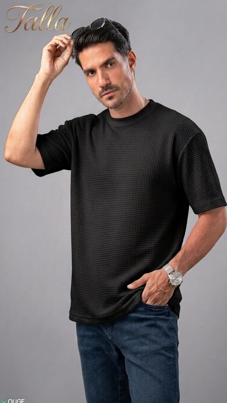 Talla | طلةّ men's black waffle-knit crew neck t-shirt with a relaxed fit worn by a model with sunglasses