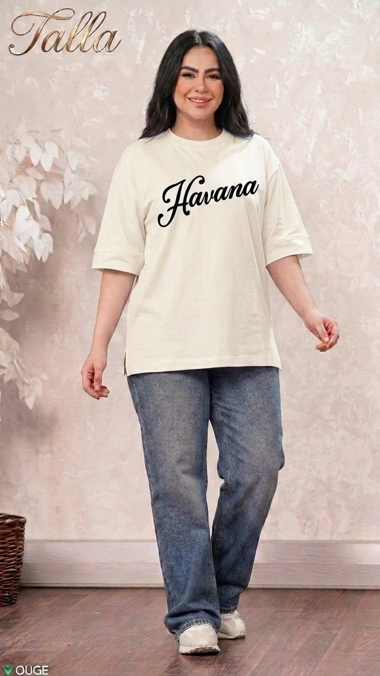 Talla | طلةّ oversized cream t-shirt with Havana graphic print, crew neck, and elbow-length sleeves worn with jeans.