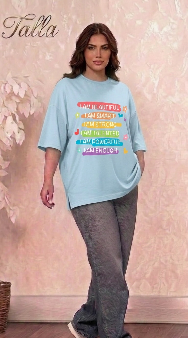 Talla | طلةّ light blue oversized cotton t-shirt with colorful inspirational graphic print and side slits on a model