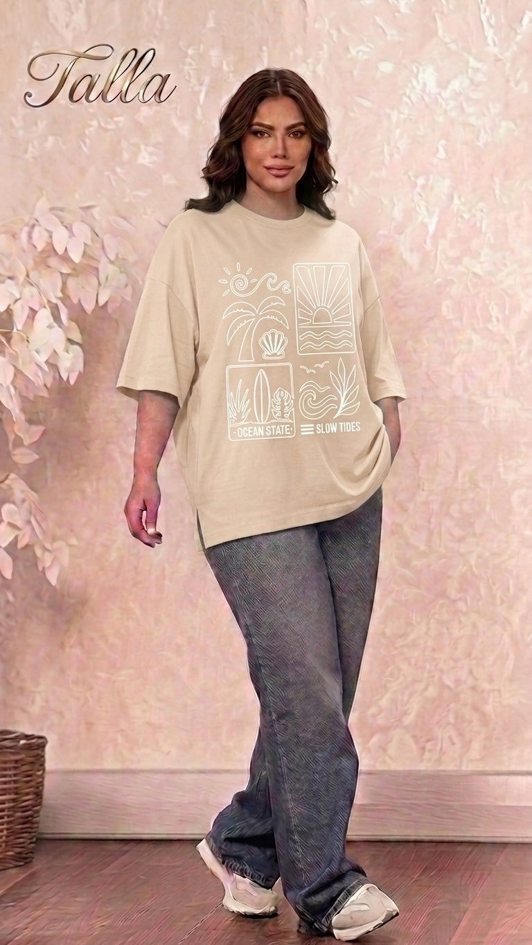 Model wearing a Talla | طلةّ beige oversized cotton t-shirt with a white coastal graphic print and dropped shoulders.