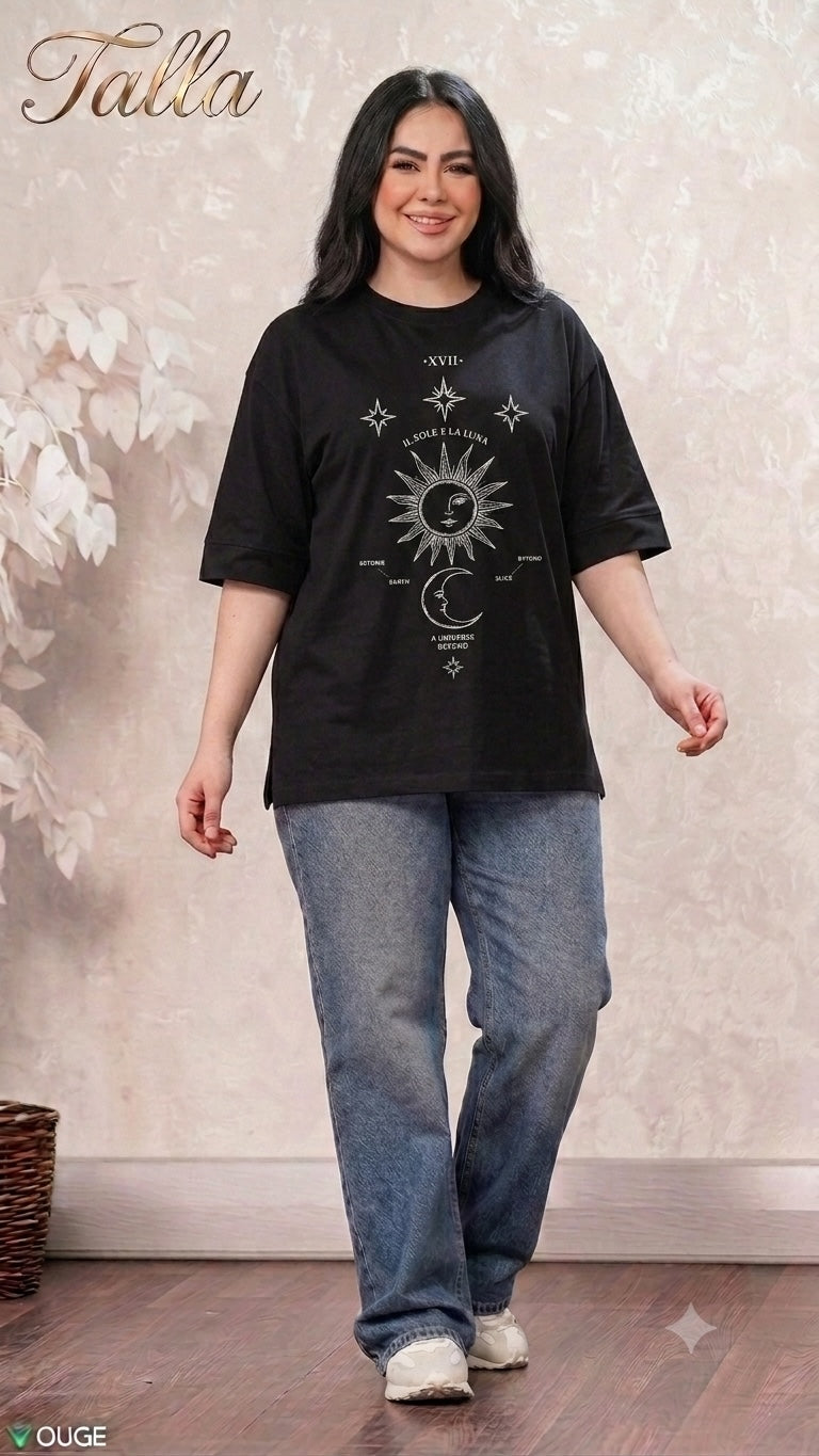 Talla | طلةّ black oversized t-shirt featuring a white celestial sun and moon graphic print worn by a smiling woman