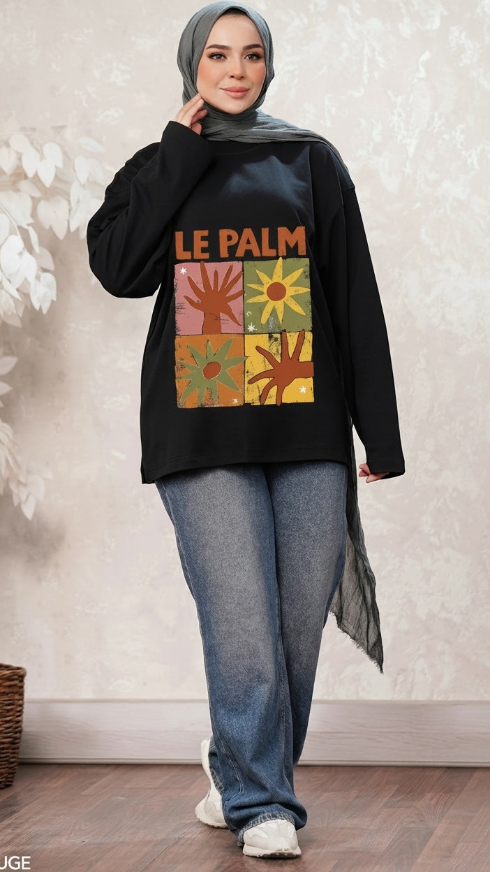 Talla | طلةّ black long sleeve sweatshirt with retro Le Palm graphic print worn by a woman in a grey hijab and jeans