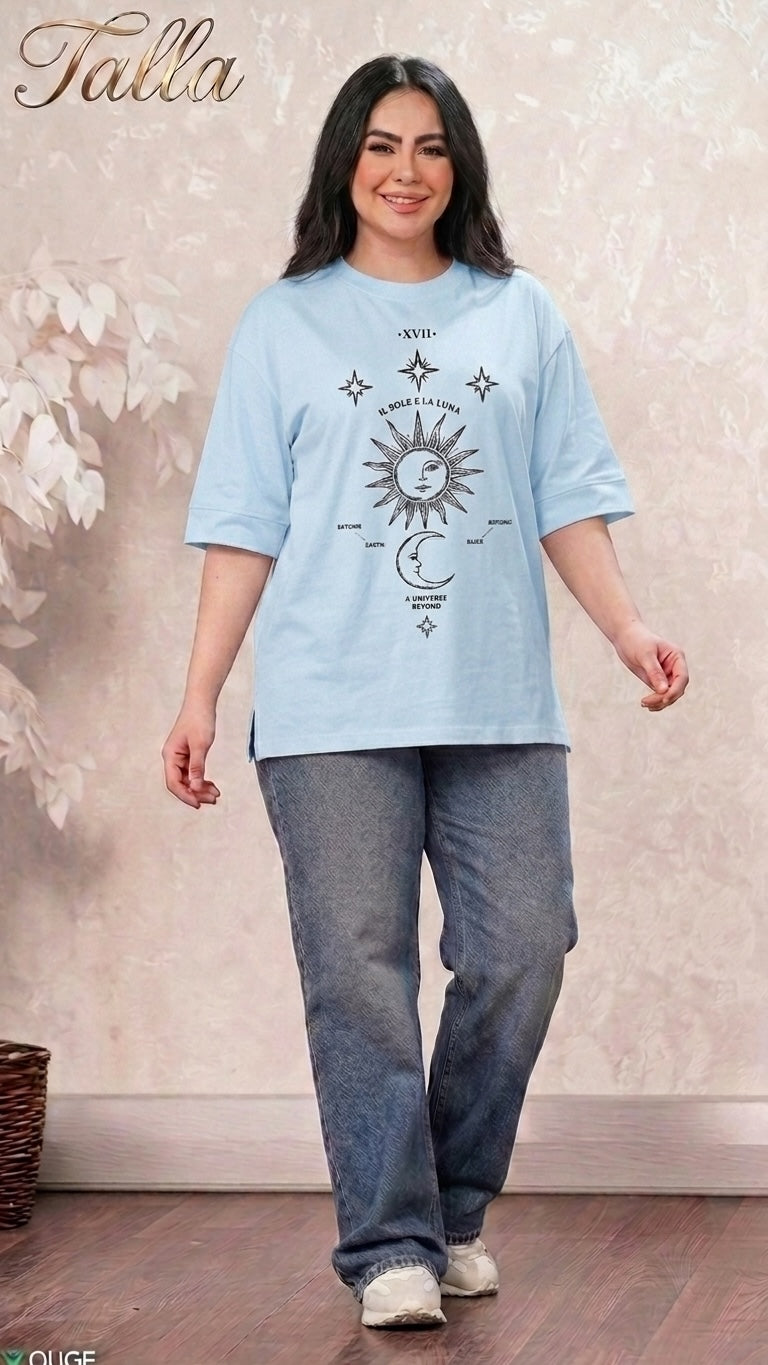 Talla | طلةّ light blue oversized t-shirt with celestial sun and moon graphic print worn by a smiling woman