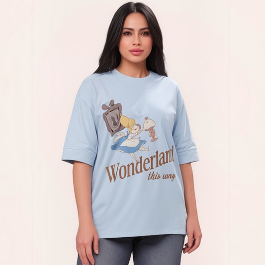 Talla | طلةّ light blue oversized cotton t-shirt with a whimsical Wonderland graphic print and elbow-length sleeves.