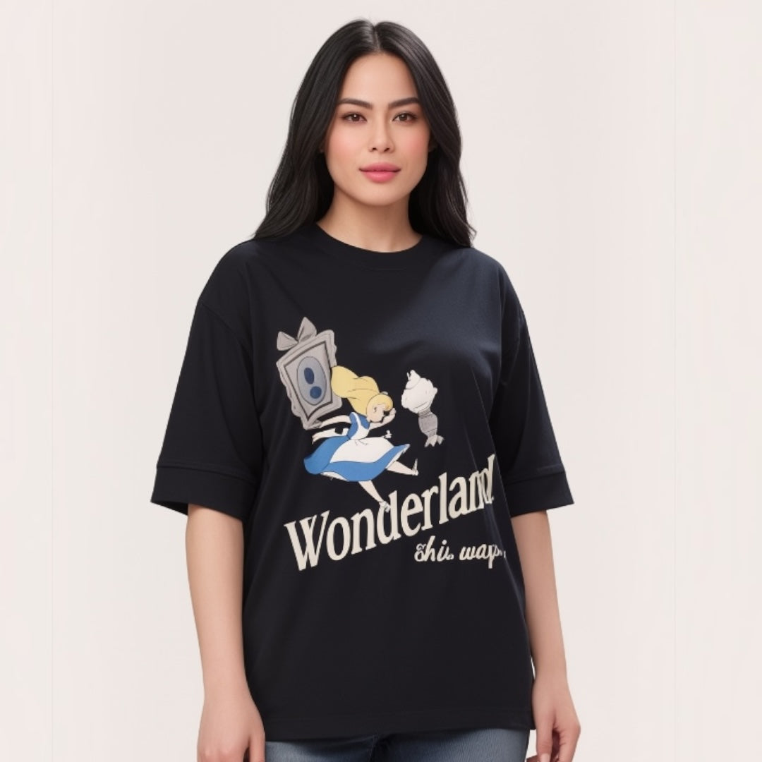Talla | طلةّ oversized black cotton t-shirt featuring a whimsical Wonderland graphic print and elbow-length sleeves.