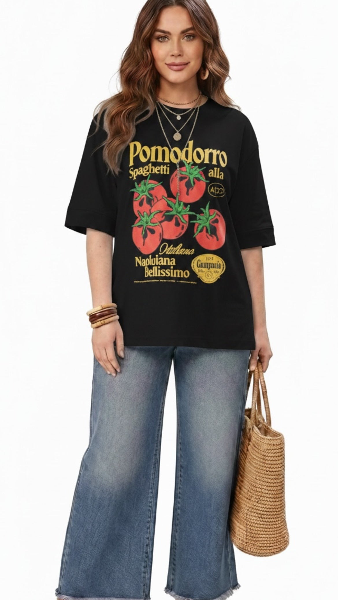Talla | طلةّ oversized black cotton t-shirt featuring a vintage tomato graphic, worn by a model with wide-leg jeans.
