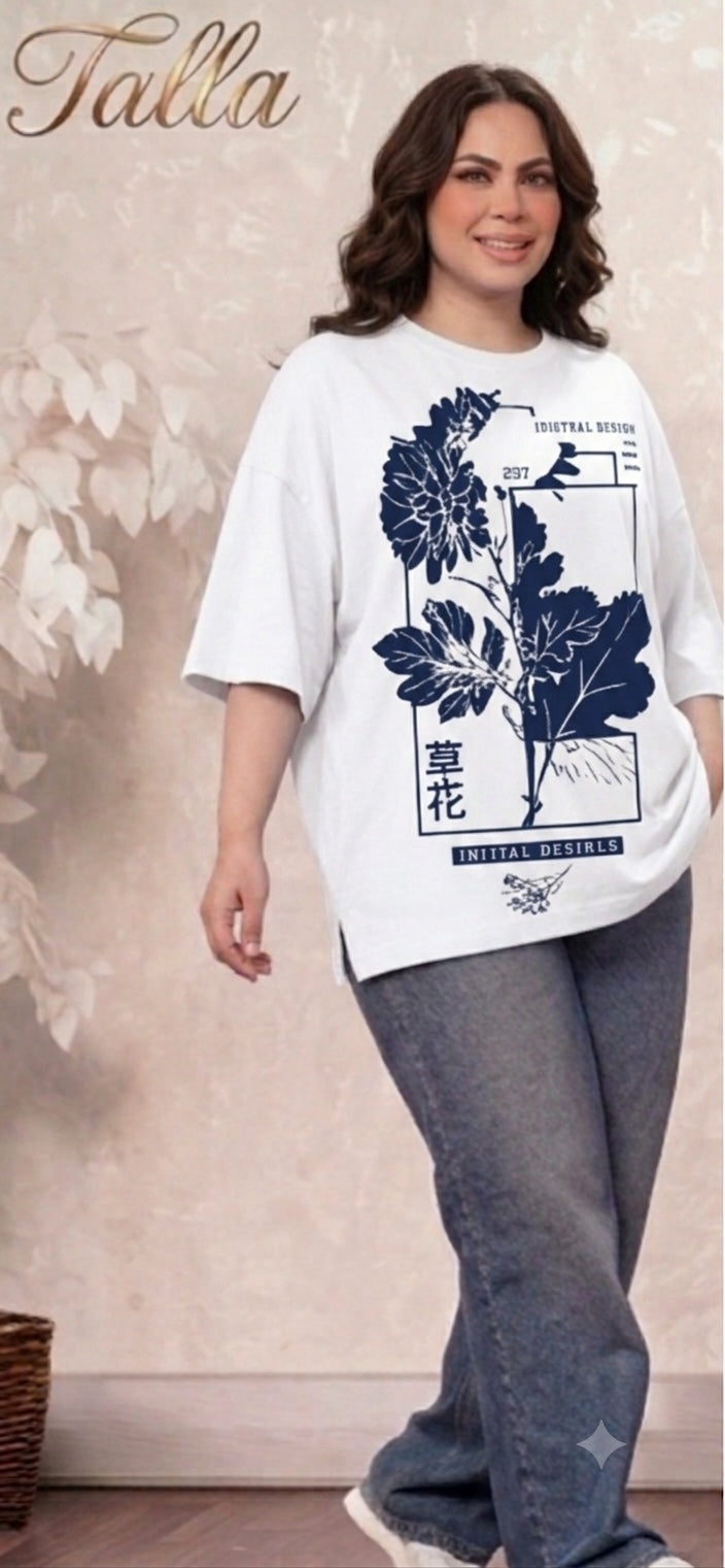 Talla | طلةّ oversized white t-shirt with navy blue floral graphic print, crew neck, and side slits on a smiling model.