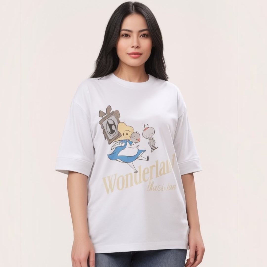Talla | طلةّ oversized white cotton t-shirt with a whimsical Wonderland graphic print and elbow-length sleeves.