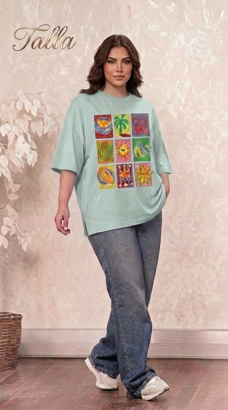 Talla | طلةّ oversized mint green t-shirt with a colorful tropical graphic print, drop shoulders, and crew neck.