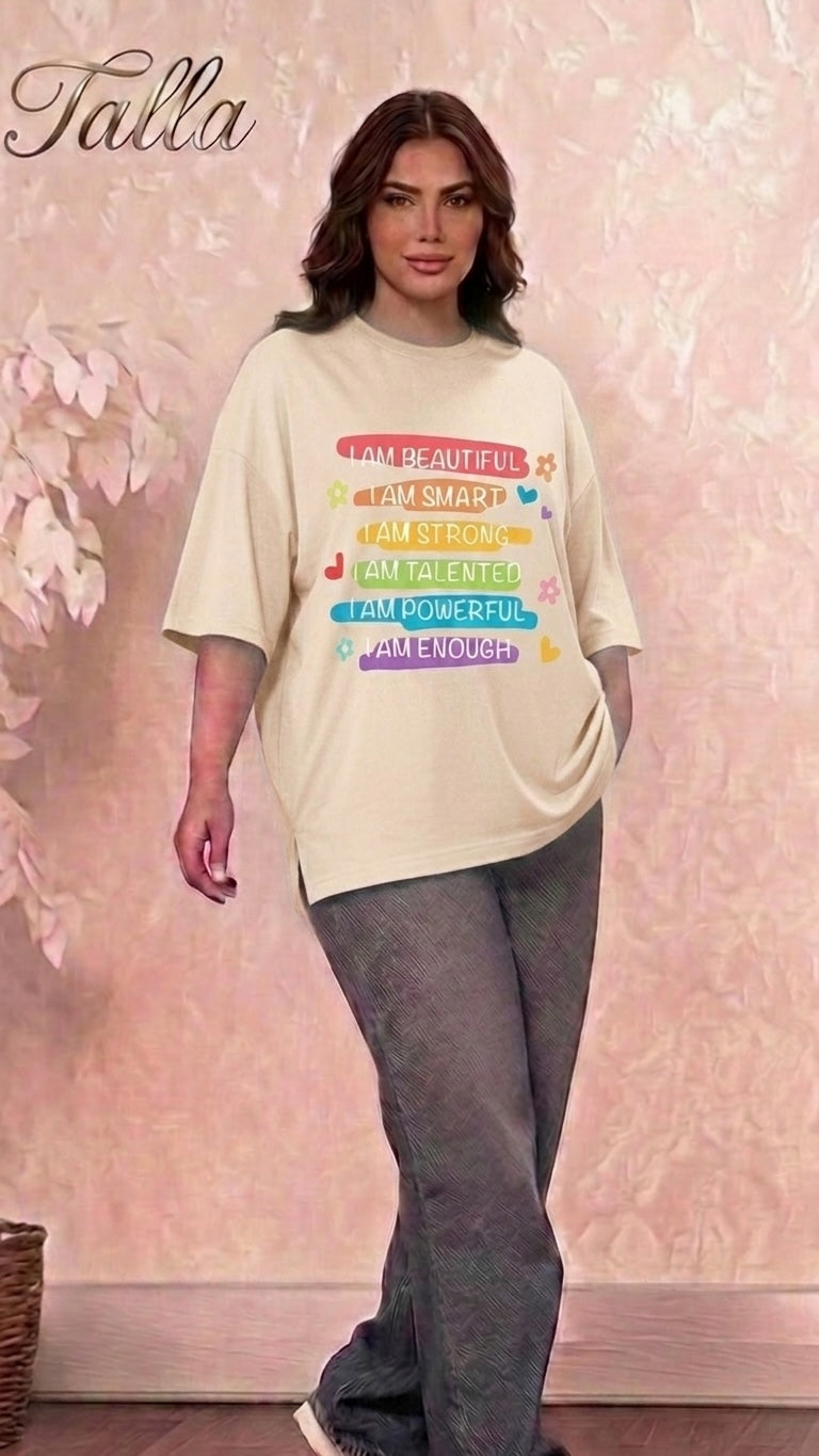 Talla | طلةّ oversized beige cotton t-shirt with colorful inspirational graphic print and side slits on a model