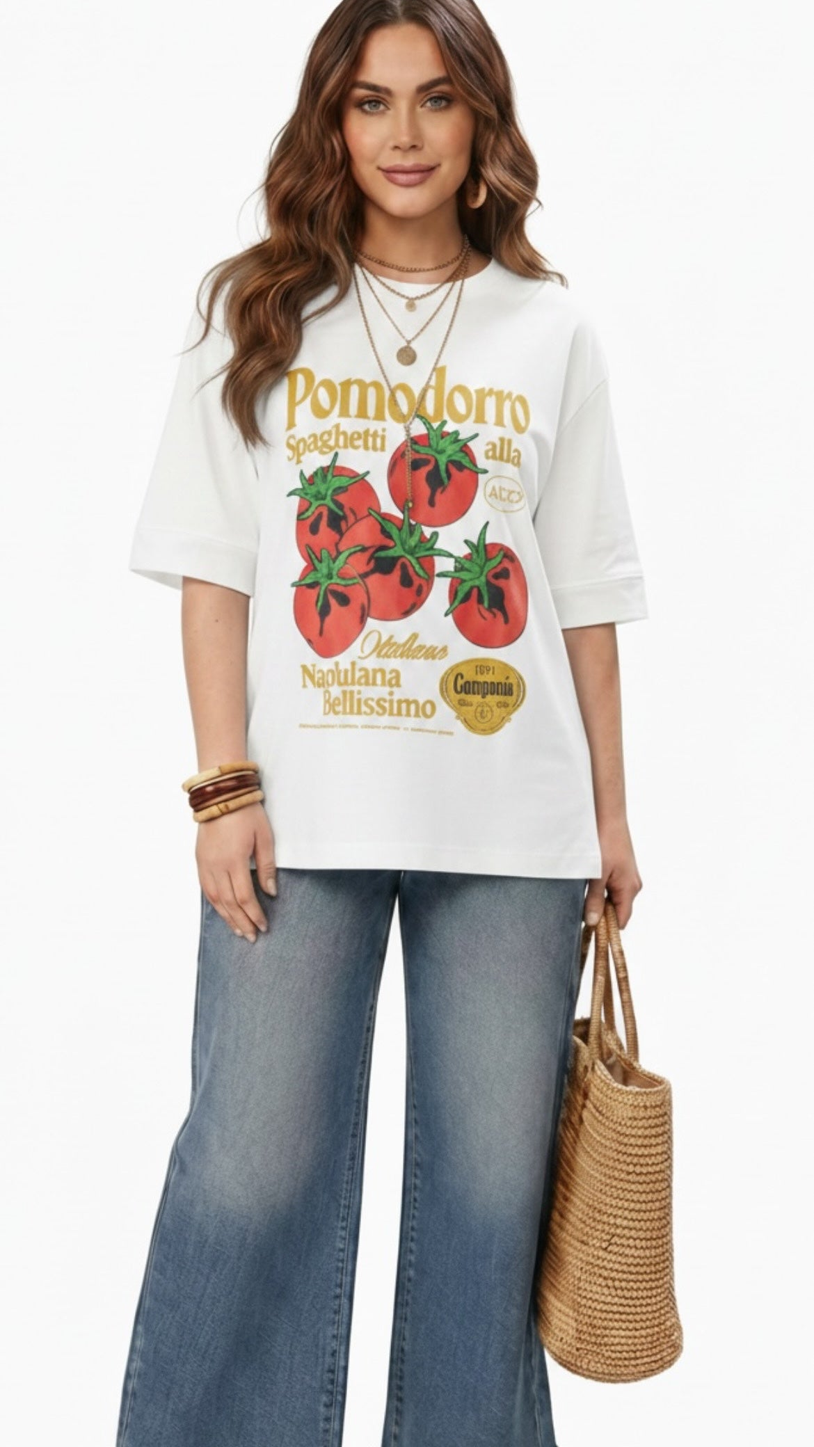 Talla | طلةّ oversized white cotton t-shirt featuring a vintage tomato graphic print worn by a woman with jeans.