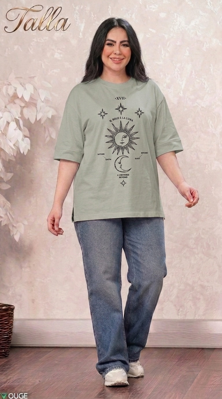 Talla | طلةّ sage green oversized t-shirt with celestial sun and moon graphic print worn by a smiling woman with jeans