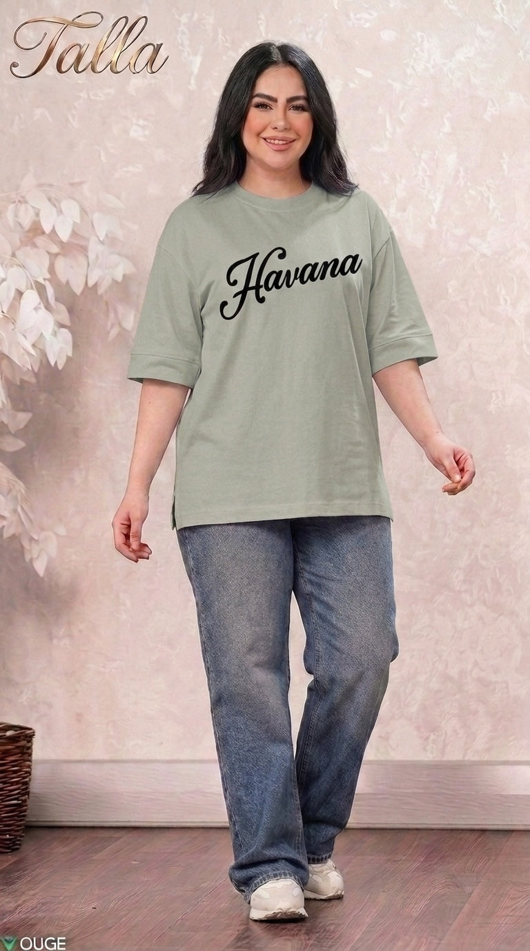 Talla | طلةّ sage green oversized Havana graphic t-shirt with crew neck and elbow sleeves worn with blue denim jeans
