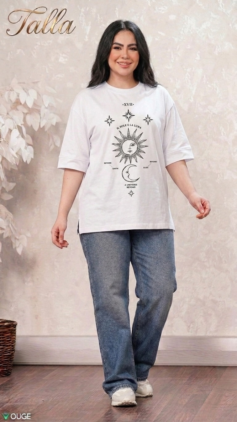 Talla | طلةّ white oversized t-shirt with black sun and moon celestial graphic print worn by a smiling woman.