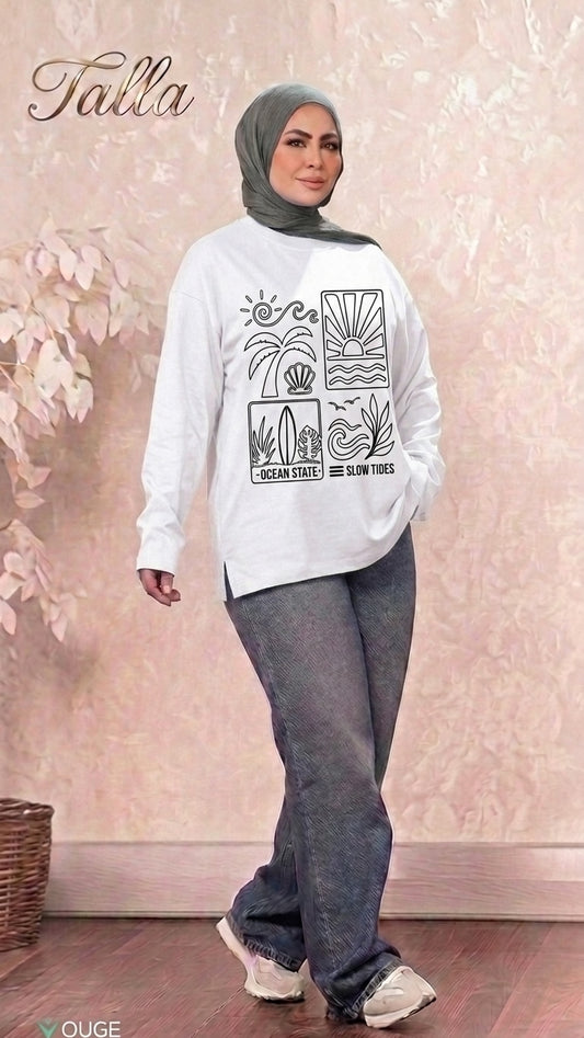 Talla | طلةّ white long sleeve sweatshirt with black coastal graphic print, worn by a woman in a grey hijab and jeans.