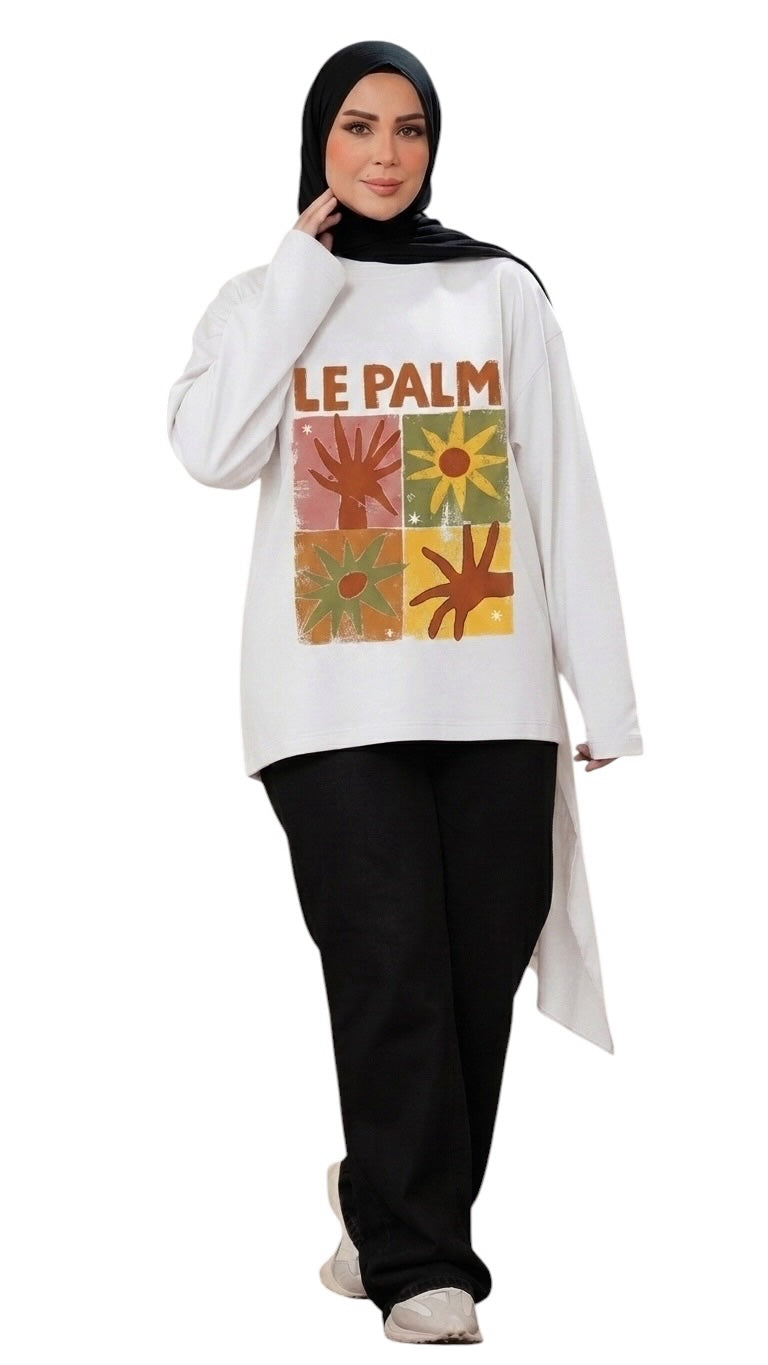 Talla | طلةّ white long-sleeve sweatshirt featuring a retro Le Palm grid graphic, worn with black trousers and hijab.