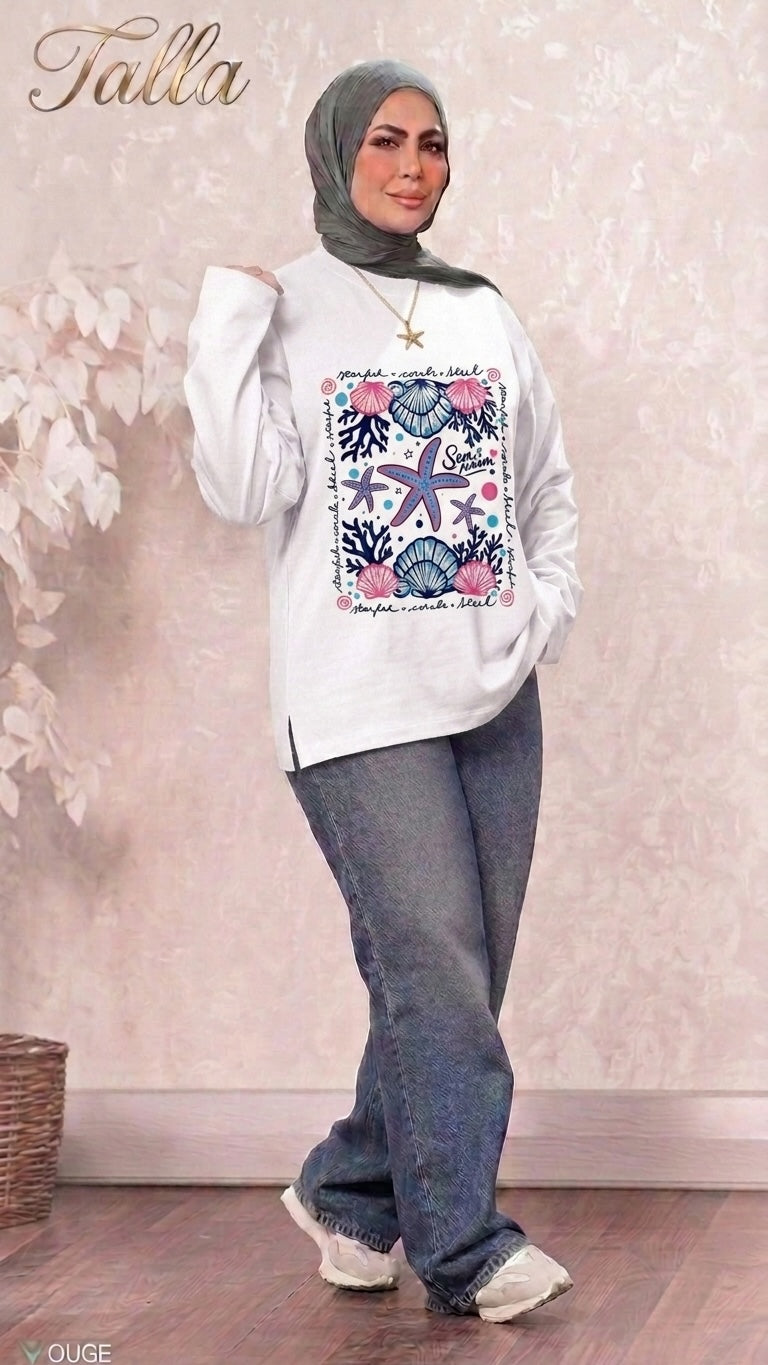 Talla | طلةّ white long sleeve sweatshirt with nautical starfish and seashell graphic print worn with jeans and hijab