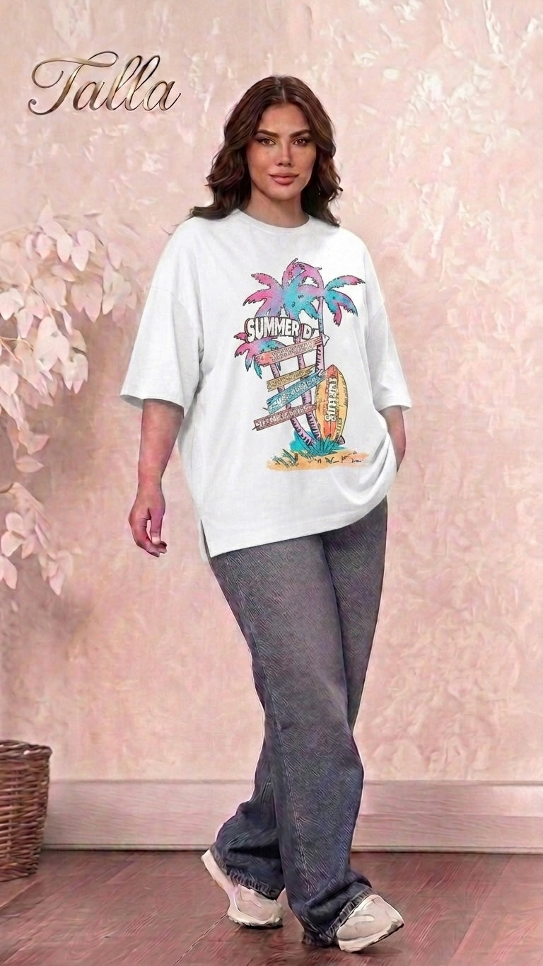 A model wearing a Talla | طلةّ white oversized graphic t-shirt with a retro summer beach print and side-slit hem.